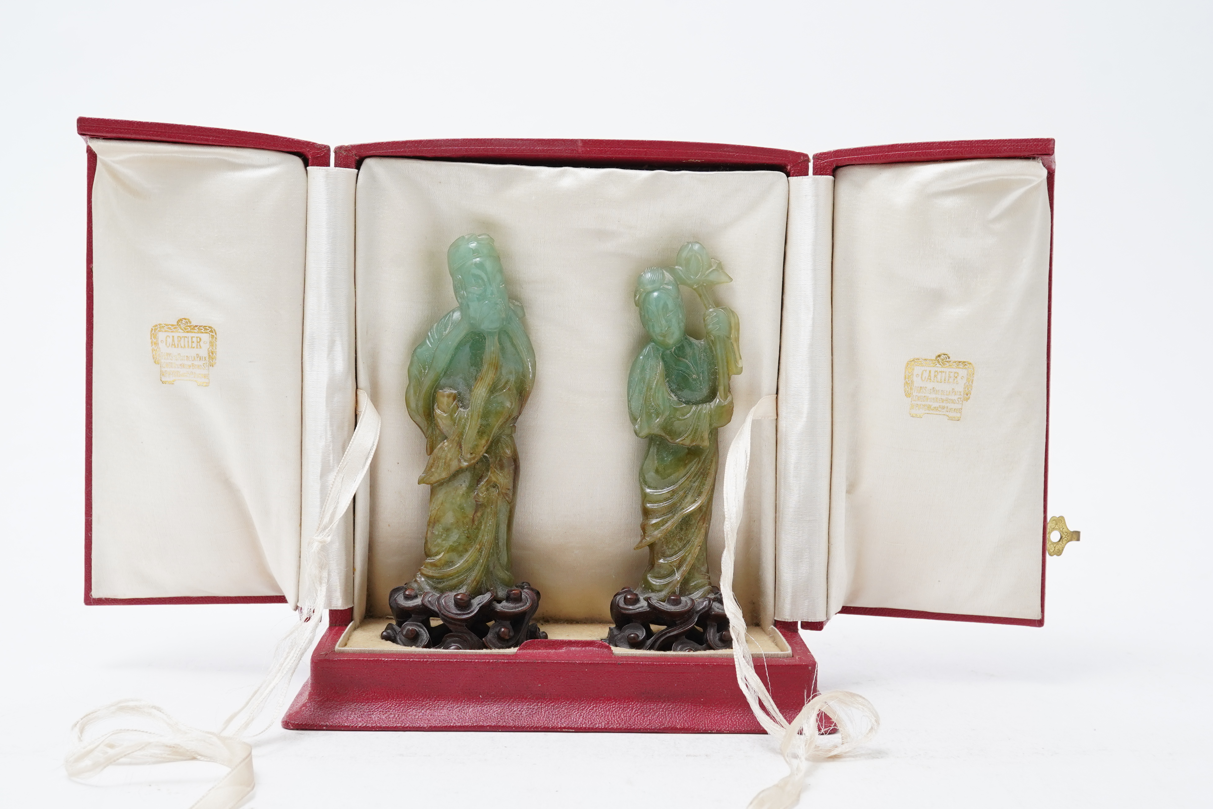 Possibly retailed by Cartier, a pair of Chinese jadeite figures, early 20th century